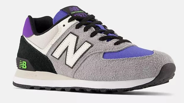 View of grey and purple New Balance shoes.